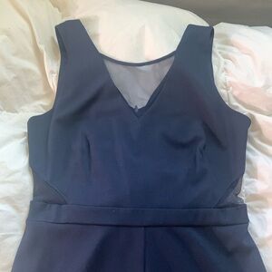 L navy jump suite with mesh details.